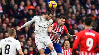 Real back in title fight after Madrid derby victory