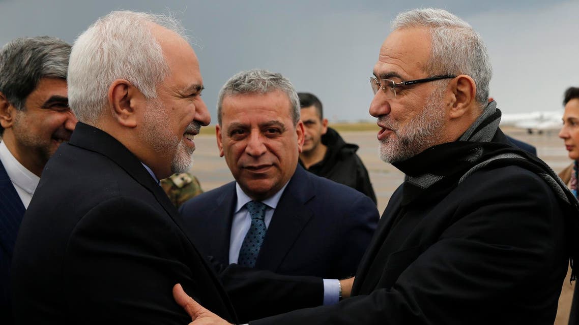 Mohammad Javad Zarif, is greeted by Lebanese Minister of State Parliamentary Affairs Mahmoud Qmati upon his arrival at Rafik Hariri Airport, in Beirut, on Sunday, February 10, 2019. (AP)