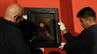 Rembrandt’s painting “Study of the head and clasped hands of a young man as Christ in prayer”, is put on display at the Louvre Abu Dhabi on February 9, 2019.