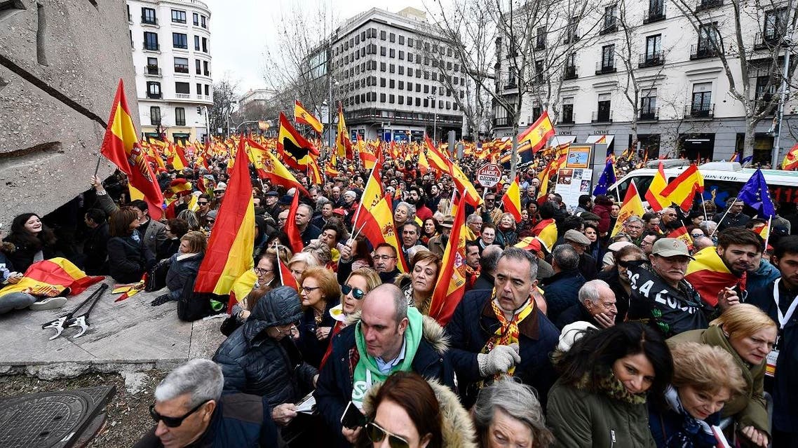 Protesters wave Spanish flags during a demonstration in Madrid (AFP)