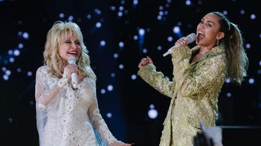 Dolly Parton and Miley Cyrus perform onstage at the 61st annual GRAMMY Awards. (AFP)