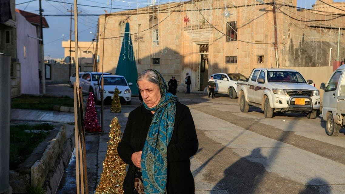 A woman walks in from of the Mart Shmony Orthodox Church in Bartella, Iraq, on January 18, 2019. (AP)