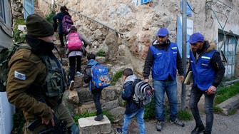 Fearing abuses amid monitors quit, Palestinians escort Hebron pupils to school