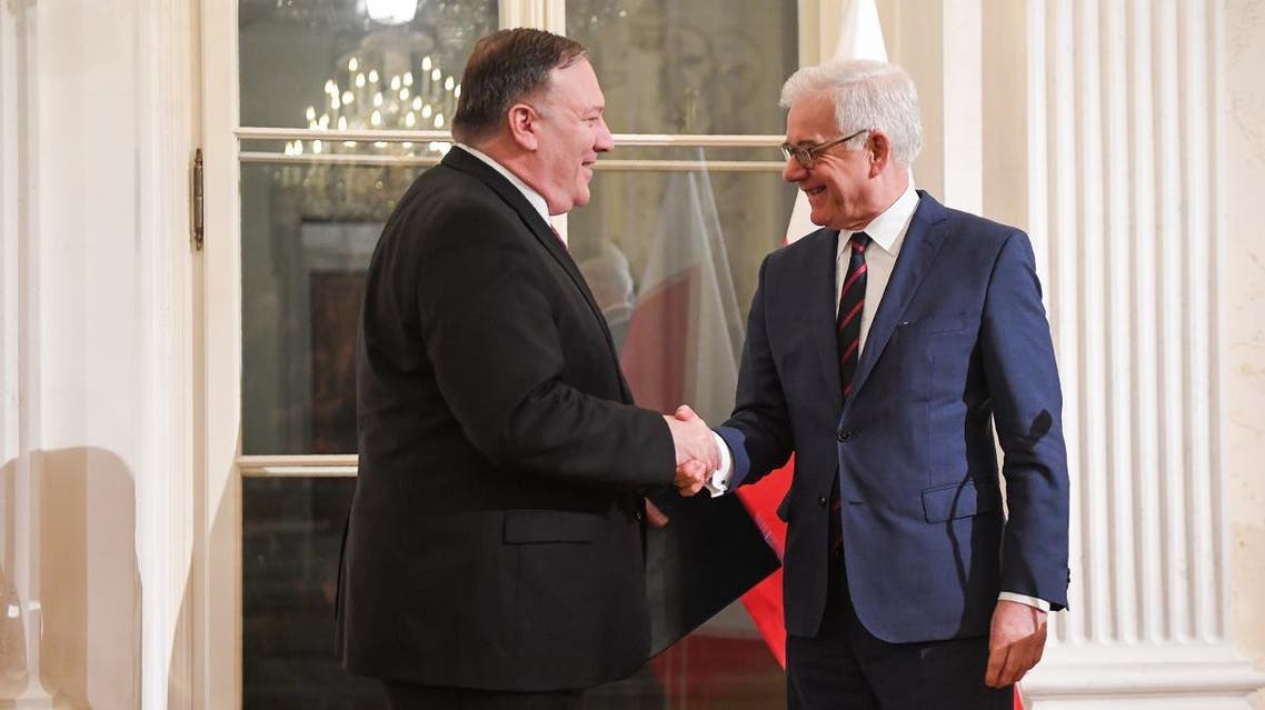 Polish Foreign Minister Jacek Czaputowicz (R) and US Secretary of State Mike Pompeo shake hands during a joint press conference on February 12, 2019, in Warsaw. (AFP)