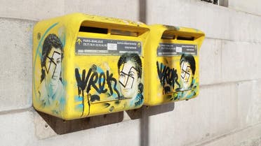 A photo taken on February 11, 2019 in the 13th arrondissement of Paris, shows Anti-Semitic graffiti written on letter boxes displaying a portrait of late French politician and Holocaust survivor Simone Veil. (AFP)