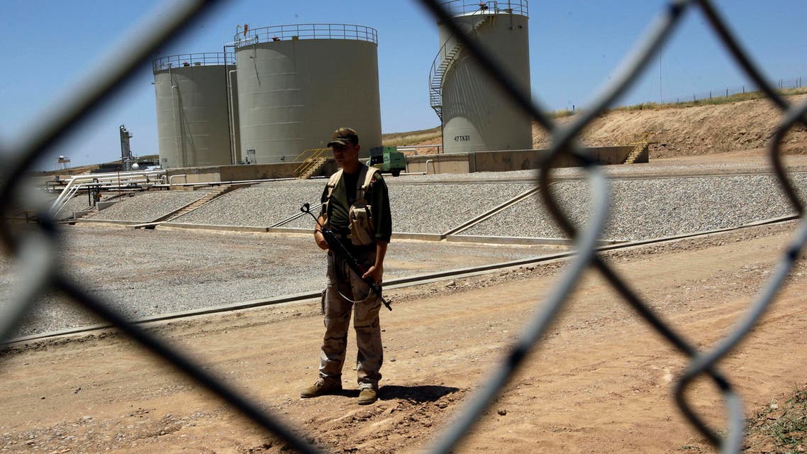 A security guard is seen at the Tawke oil refinery near the village of Zacho, in the autonomous Iraqi region of Kurdistan, on May 31, 2009. Iraq's self-ruled Kurdish region will begin exporting crude oil for the first time on June 1, piping up to 90,000 bpd to its neighbours, officials said. Initial exports will be around 40,000 barrels per day from the Taq Taq field in the province of Arbil and another 50,000 bpd from the Tawke field in Dohuk, company officials told AFP. AFP PHOTO/ALI AL-SAADI