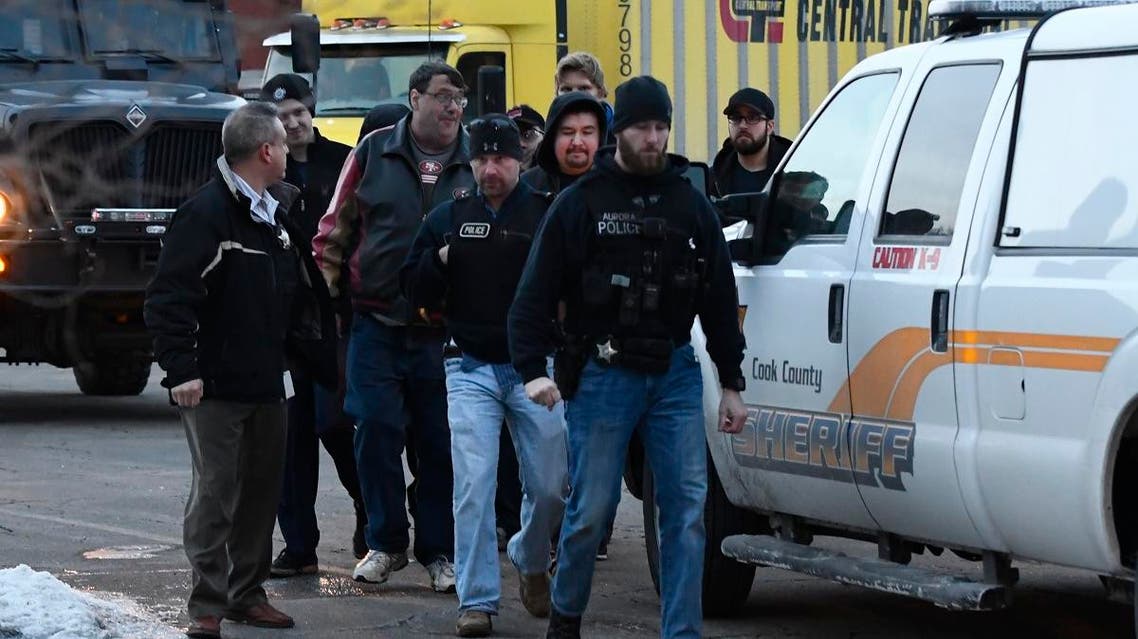 Employees are escorted from the scene of a shooting at a manufacturing company, Friday, Feb. 15, 2019. (AP)