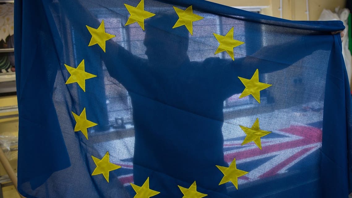 Andy Ormrod, the owner of Flying Colours Flagmakers Ltd, inspects a newly produced European Union (EU) flag in their premises in Knaresborough, northern England on February 7, 2019. At a flag-making workshop in northern England, orders for Unions Flags are flying while the EU's blue-and-yellow standard is proving less and less popular. Flying Colours, which makes flags for Britain's royal palaces, has seen EU flag orders drop by 90 percent since the country voted to leave the bloc in 2016.