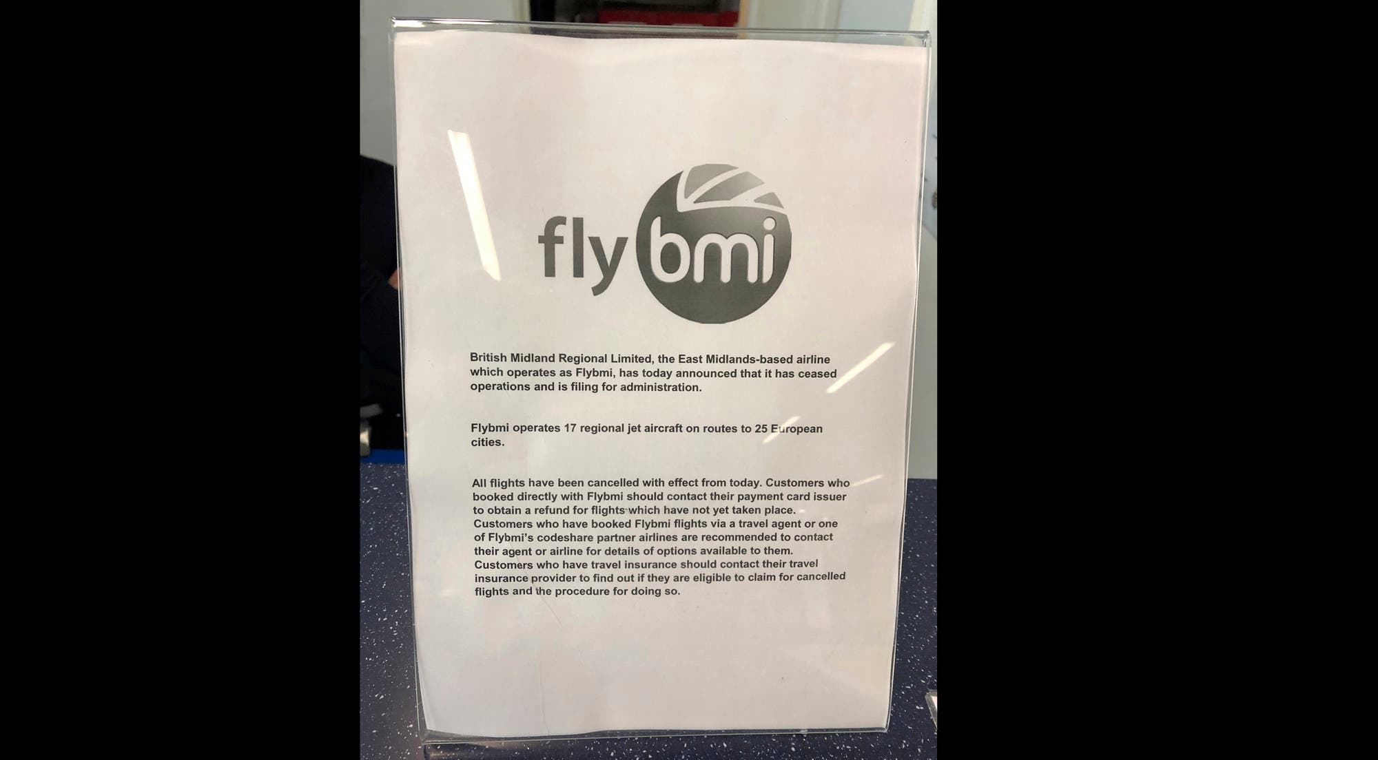 A notice informing passengers that flybmi flights have been cancelled following the collapse of the airline, at Bristol Airport in Bristol, England. (AP)
