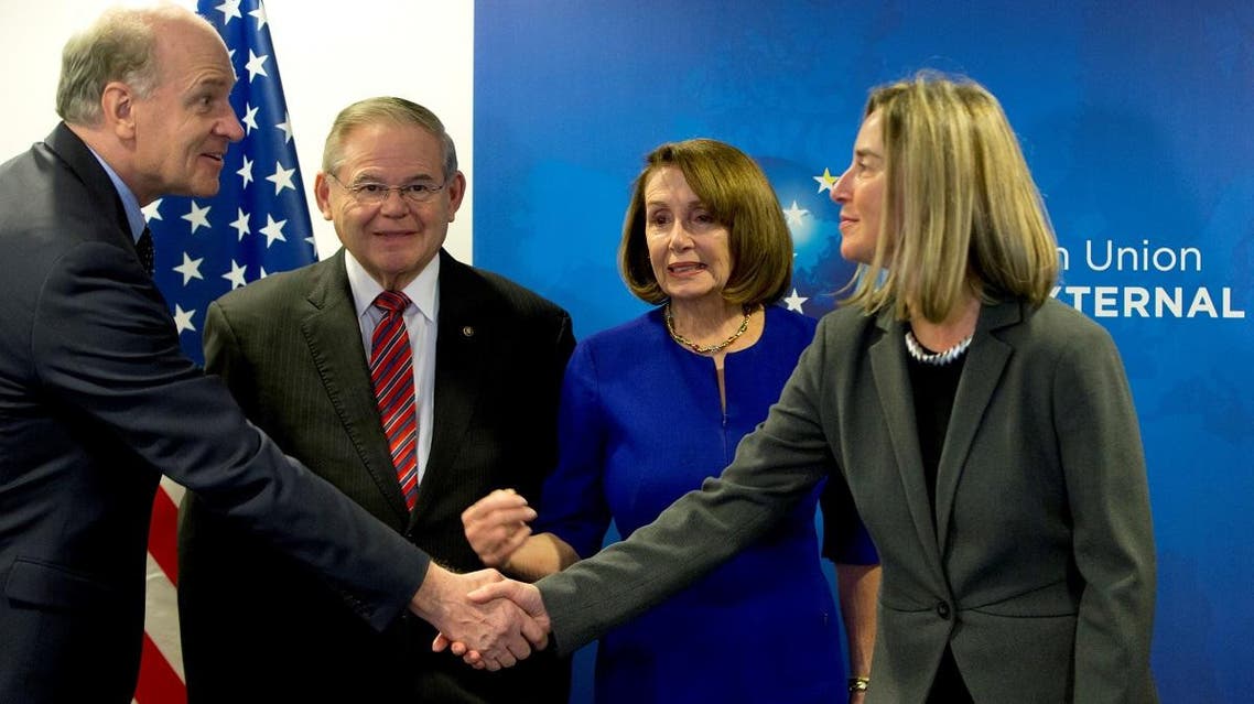 EU foreign policy chief Federica Mogherini (R) shakes hands with US Congressman Bill Keating eyed by US Speaker of the House Nancy Pelosi, and US Senator Bob Menendez prior to their meeting in Brussels, on February 19, 2019 at the EU headquarters in Brussels. (AFP)