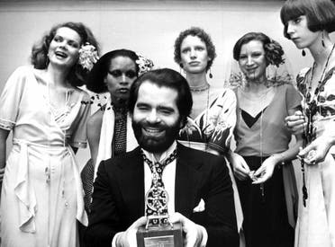 German fashion designer Karl Lagerfeld posing with models after receiving an award in Krefeld, western Germany, on November 29, 1973. (AFP)