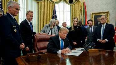 President Donald Trump signs “Space Policy Directive 4” in the Oval Office of the White House on February 19, 2019. (AP)