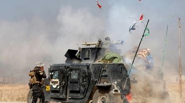 FILE PHOTO - An Iraqi special forces soldier fires a cannon at Islamic States fighters in Bartella, east of Mosul, Iraq October 20, 2016. REUTERS/Goran Tomasevic/File Photo