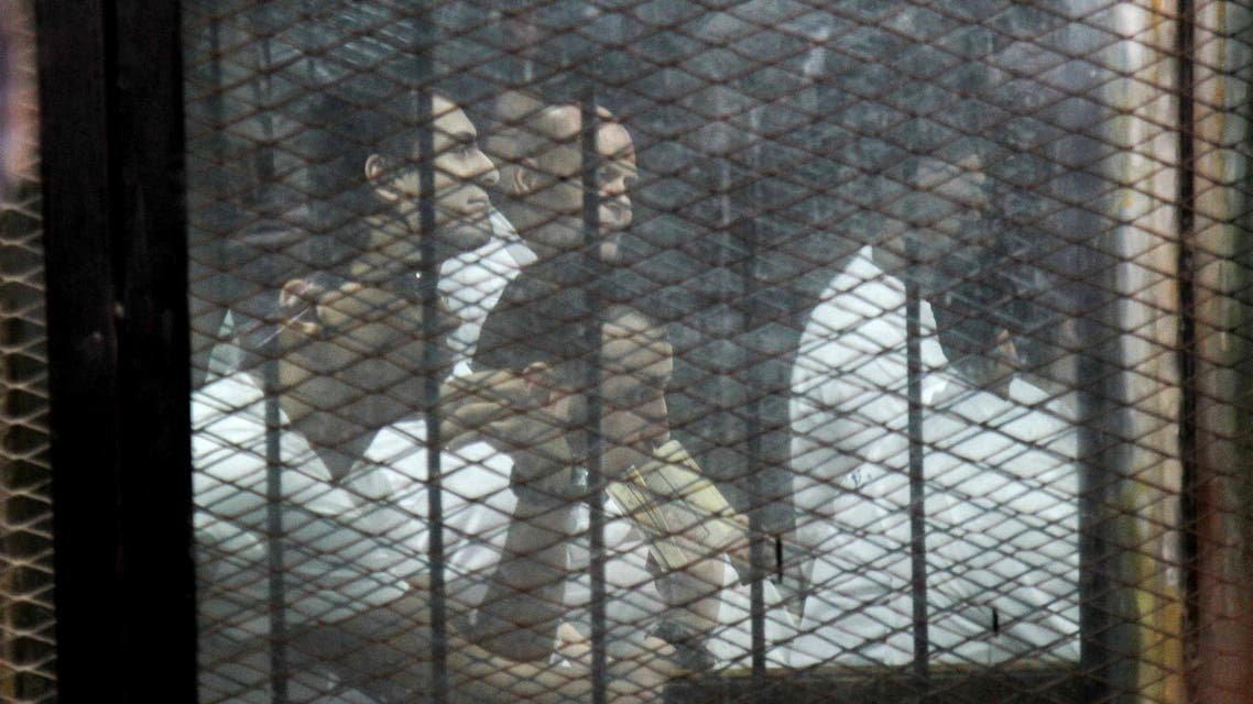 Egyptian defendants accused of forming a militant cell that assassinated Hisham Barakat in 2015, sit during a court hearing on June 17, 2017. (AFP)
