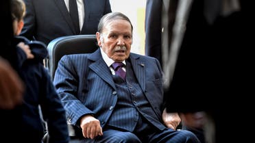 (FILES) In this file photo taken on November 23, 2017, Algerian President Abdelaziz Bouteflika is seen while voting at a polling station in the capital Algiers during polls for local elections. Algeria's ailing President Abdelaziz Bouteflika will seek a fifth term in April elections, the country's official APS news agency said on February 10. The 81-year-old head of state, in power since 1999, announced his candidacy in a message to the nation sent to the agency, said APS, which will release it later in the day.