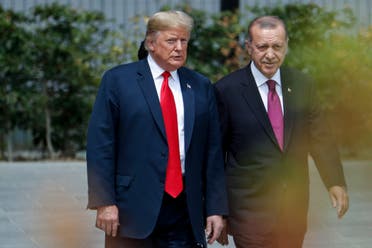 US President Donald Trump (L) speaks to Turkey's President Recep Tayyip Erdogan during the opening ceremony of the NATO (North Atlantic Treaty Organization) summit, at the NATO headquarters in Brussels, on July 11, 2018. (AFP)