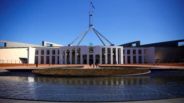 Tourists walk around the forecourt of Australia's Parliament House in Canberra, Australia, October 16, 2017. (Reuters)