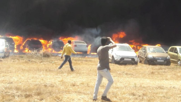 Fire at government-run airshow in India destroys hundreds of cars