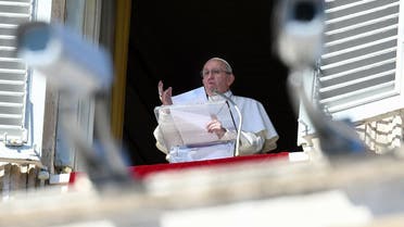Pope Francis delivers his message from the window of the Apostolic palace as he arrives for the weekly Angelus prayer. (AFP)