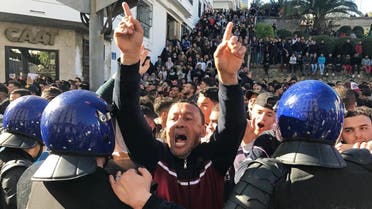 A man gestures and shouts near riot police during a protest against President Abdelaziz Bouteflika's plan seeking a fifth term in April elections in Algiers, Algeria, March 1, 2019. (Reuters)