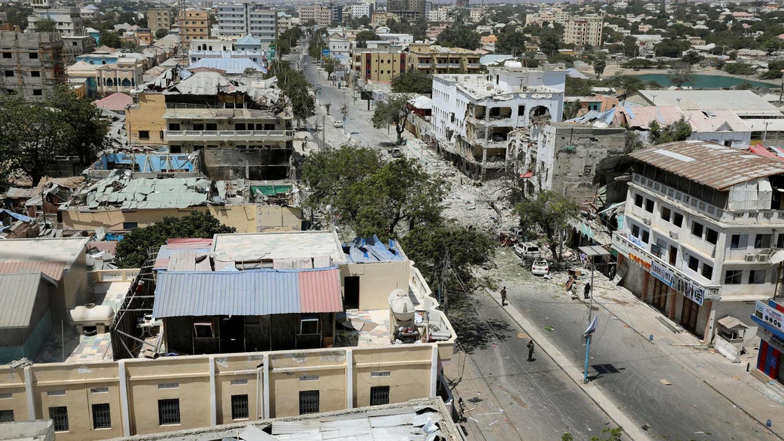 Security personnel are seen next to buildings damaged at the scene where a suicide car bomb exploded targeting a Mogadishu hotel in a business center in Maka Al Mukaram street in Mogadishu, Somalia. March 1, 2019. REUTERS/Feisal Omar