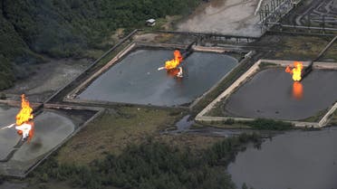 A picture taken on March 22, 2013 shows gas flare at Shell Cawtharine Channel, Nembe Creek in the Niger Delta. Shell Petroleum Development Company of Nigeria (SPDC) on April 2, 2013 said it would temporarily shut down production the Nembe Creek Truck Line (NCTL) to remove a number of bunkering points on pipelines vandalised by oil thieves in the region. AFP PHOTO / PIUS UTOMI EKPEI