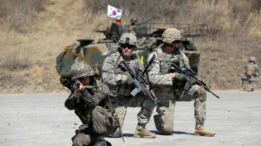 U.S. Army soldiers from the 25th Infantry Division’s 2nd Stryker Brigade Combat Team and a South Korean soldiers take their position during a demonstration of the combined arms live-fire exercise as a part of the annual joint military exercise Foal Eagle between South Korea and the United States (AP)