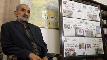Hossein Shariatmadari, director of the hardline Kayhan (Universe) newspaper group since 1993, sits next issues of the newspaper at his office in Tehran. (File photo: AFP)