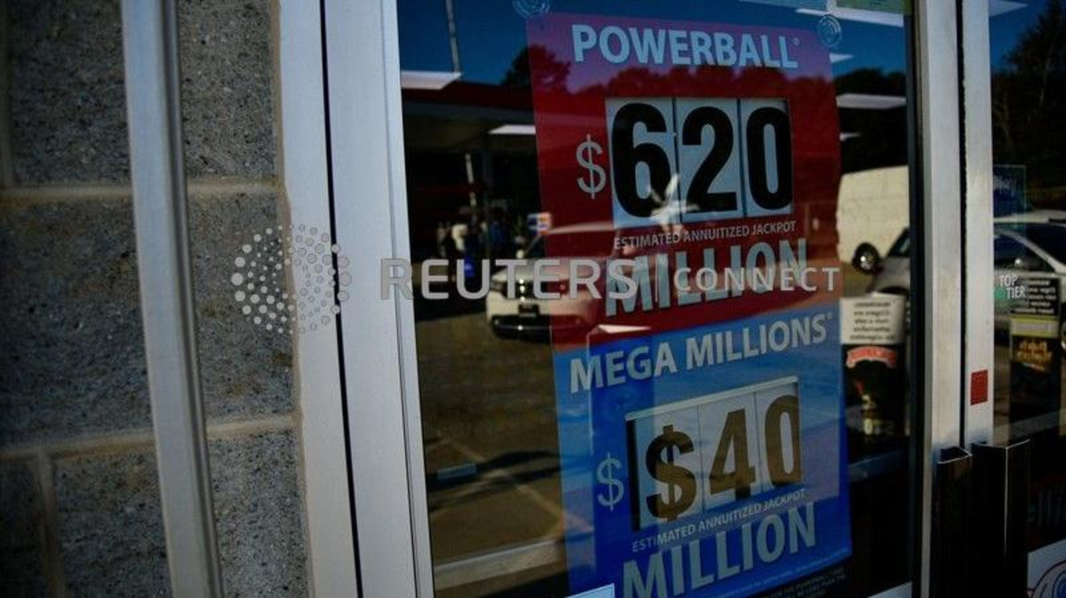 A sign advertising the next Powerball and Mega Millions jackpots at the KC Mart in South Carolina on October 24, 2018. (Reuters)