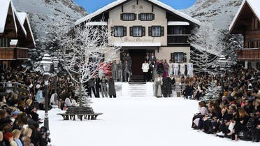 Models observe a minute's silence in tribute to Chanel’s late German fashion designer, Karl Lagerfeld, ahead of the Women's fashion show at the Grand Palais in Paris, on March 5, 2019. (AFP)