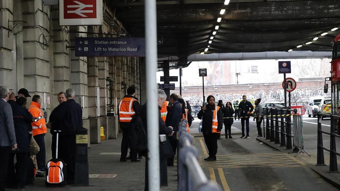 Security personel stand guard outside Waterloo station in central London. (AFP)
