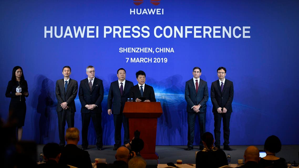 Huawei’s rotating chairman Guo Ping (C) speaks during a press conference in Shenzhen, on March 7, 2019. (AFP)