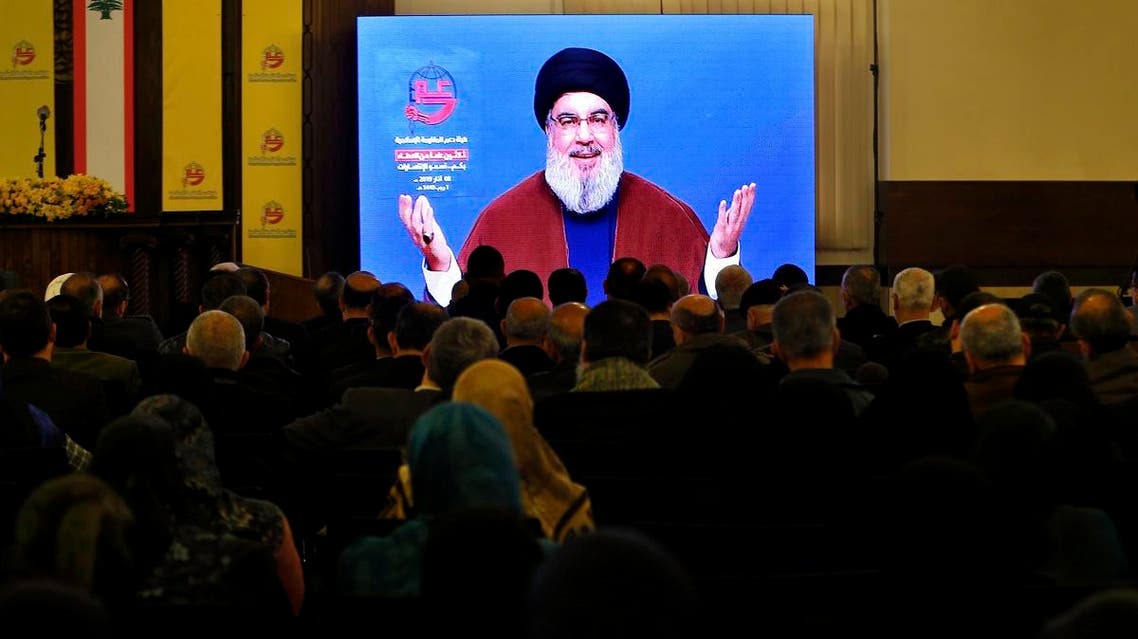 Supporters of the Iranian-backed Hezbollah group listen to a speech of leader Sayyed Hassan Nasrallah, via a video link, in a southern suburb of Beirut, Lebanon, on March 8, 2019. (AP)