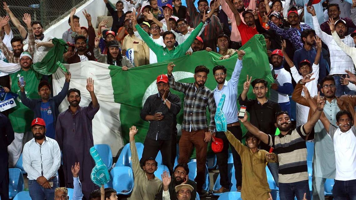 Cricket fans cheer during Pakistan Super League cricket match between Islamabad United and Lahore Qalandars at National Stadium in Karachi, Pakistan. (AFP)
