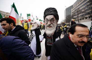 Effigies of Iranian President Hassan Rouhani and Iran’s supreme leader Ayatollah Ali Khamenei march with the Organization of Iranian-American Communities on March 8, 2019 in Washington, DC. (AFP)