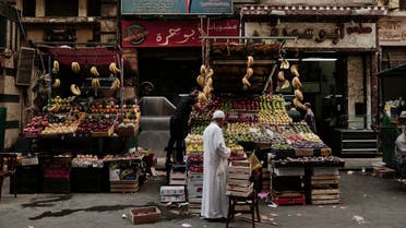 A fruit vendor waits for customers in Tawfiqia market in downtown Cairo, Egypt. (File photo: AP)
