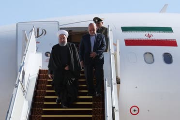 Iranian President Hassan Rouhani and Iranian Ambassador to Iraq Iraj Masjedi arrive to Baghdad airport, in Baghdad, Iraq March 11, 2019. (Reuters)