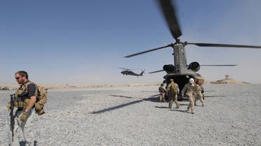 U.S solders disembark from a Chinook helicopter in the southern town of Qalat, the capital of Zabul province, 02 October 2006. US Senate majority leader Bill Frist is currently visiting Afghanistan with fellow senator Mel Martinez. AFP PHOTO/ SHAH Marai
