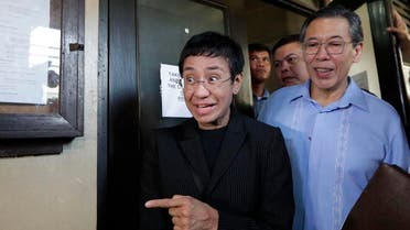 Maria Ressa, head of the Philippine online news site Rappler, gestures as she walks outside the Regional Trial Court branch 46 in Manila, Philippines on Friday, March 1, 2019. (AP)