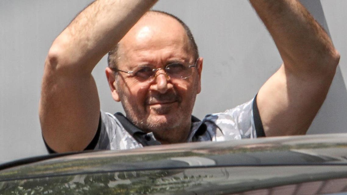 FILES) In this file photo taken on July 3, 2018 Oyub Titiyev, head of the Chechen section of the rights group Memorial, gestures as he leaves a court building in Grozny. Russian prosecutors on March 11, 2019 asked a court to sentence a top rights activist in Chechnya to four years in a penal colony, over what campaigners say are trumped-up drug charges. Oyub Titiyev, the 61-year-old head of the Chechnya branch of rights group Memorial, was arrested at the start of last year. AFP