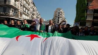Thousands demand quick change in Algeria after Bouteflika concessions