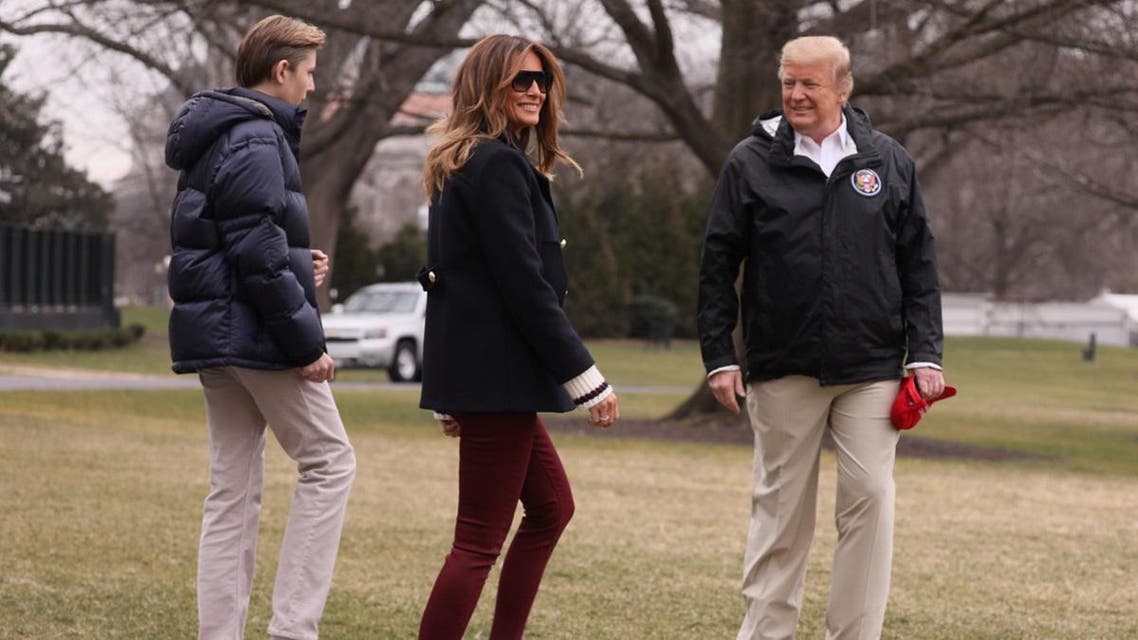 US President Donald Trump walks with son Barron and first lady Melania Trump as he departs to visit storm-hit areas of Alabama from the White House. (Reuters)