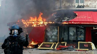 France cleans up Champs-Elysees after yellow vest rioting