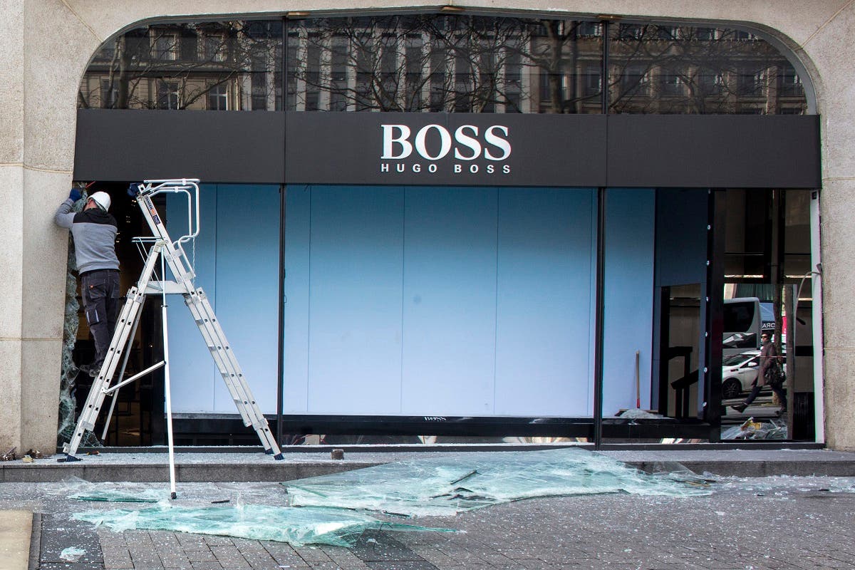 Burned stores on the Champs Elysees avenue during a yellow vests demonstration Saturday, March 16, 2019 in Paris. (AFP)
