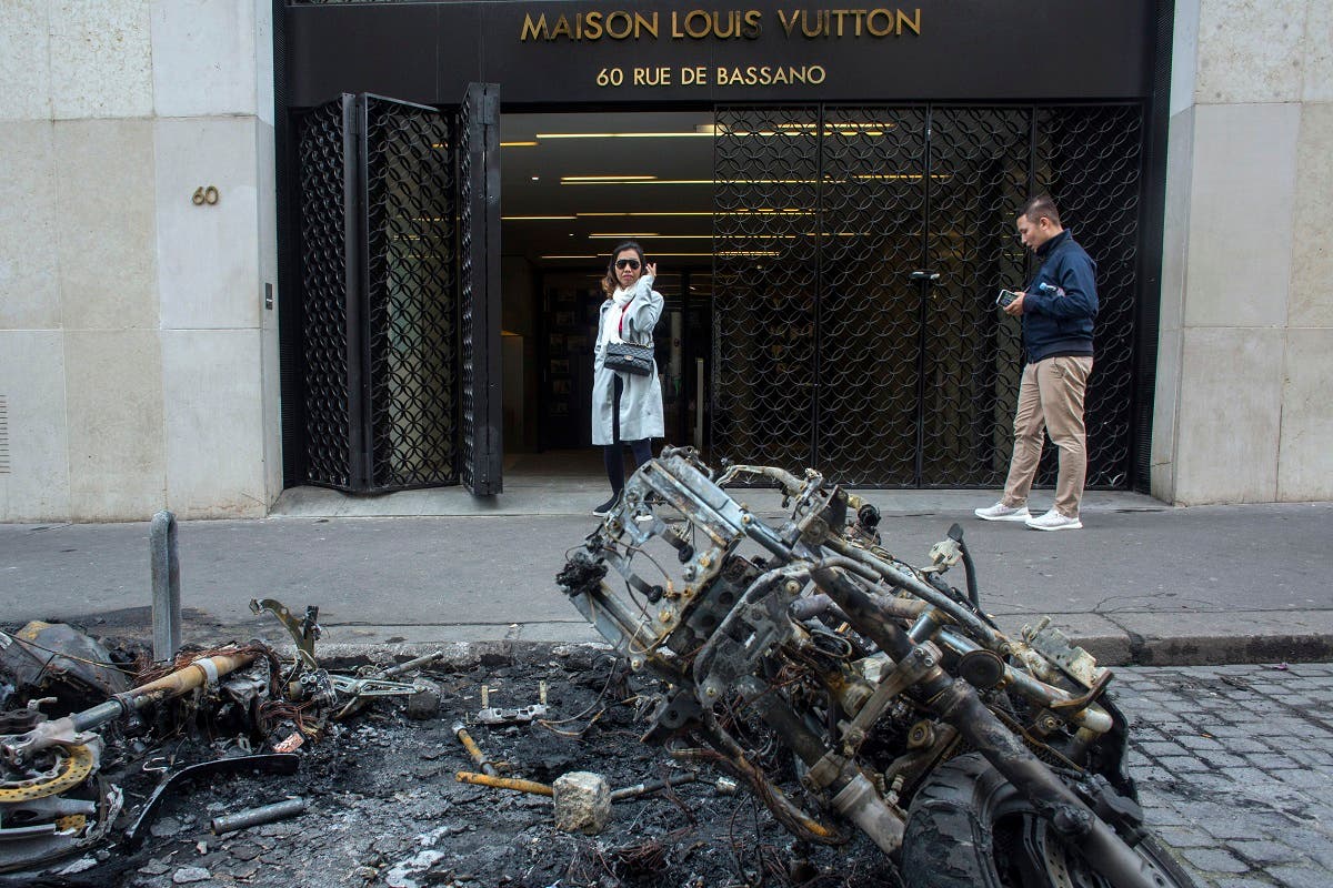 Burned stores on the Champs Elysees avenue during a yellow vests demonstration Saturday, March 16, 2019 in Paris. (AFP)