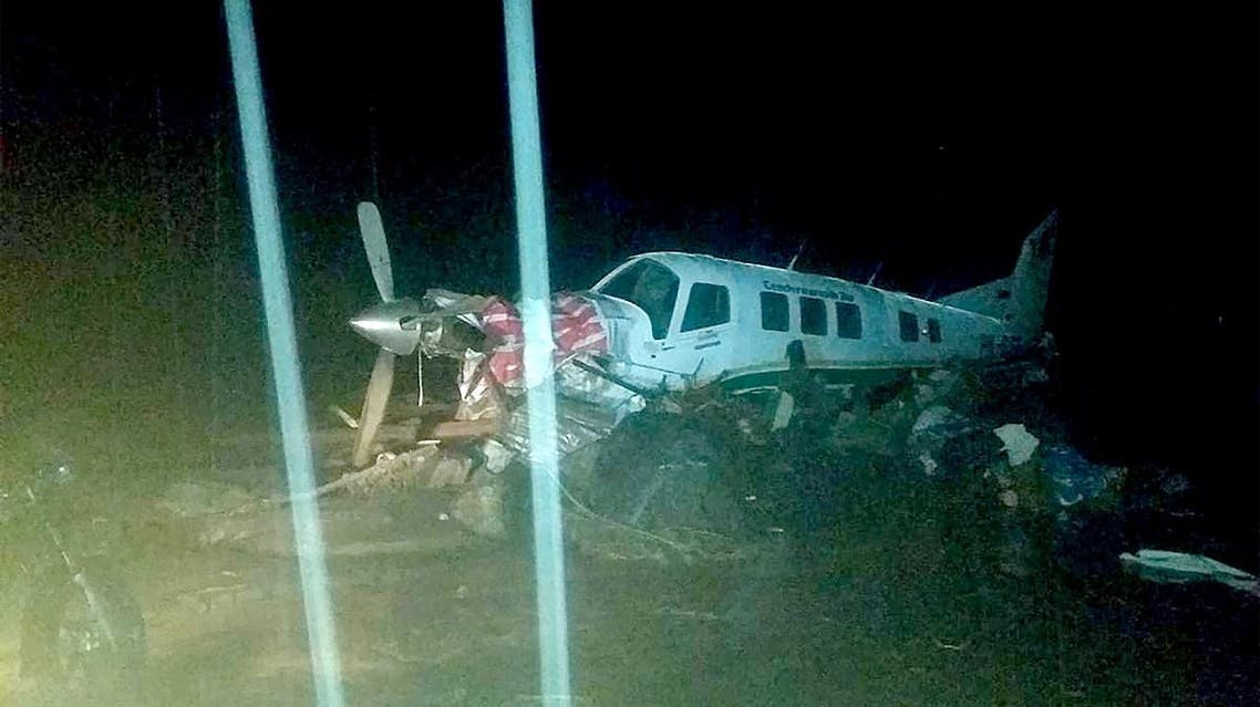 This handout picture taken and released by Indonesia's accident mitigation agency on March 17, 2019 shows a small plane on an airstrip surrounded by floodwaters in Sentani, triggered by torrential rain. (AFP)