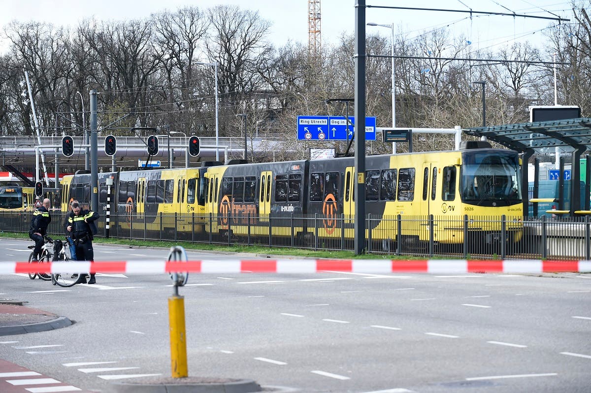 Policemen are at work on March 18, 2019 in Utrecht, near a tram where a gunman opened fire, killing at least three persons and wounding several in what officials said was a possible terrorist incident.