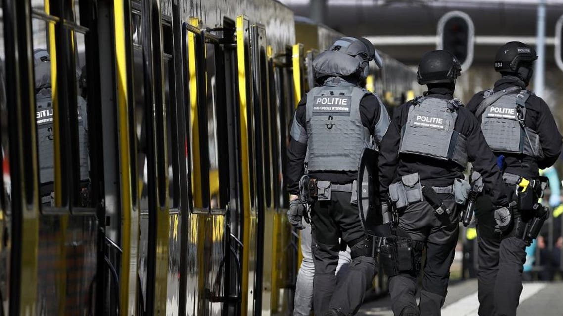 Police forces walk near a tram at the 24 Oktoberplace in Utrecht, on March 18, 2019 where a shooting took place. (AFP)