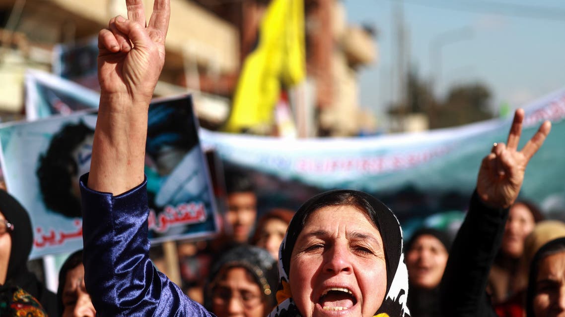 Syrian Kurdish women flash the V-sign for victory during a demonstration in Qamishli on January 20, 2019, marking the first anniversary of the takeover of the northern Syrian city of Afrin by the Turkish army and Turkish-backed Syrian rebels. A bomb exploded in Afrin today, killing three people and wounding nine others, according to a war monitor, on the first anniversary of a Turkish offensive on the Kurdish-majority region.