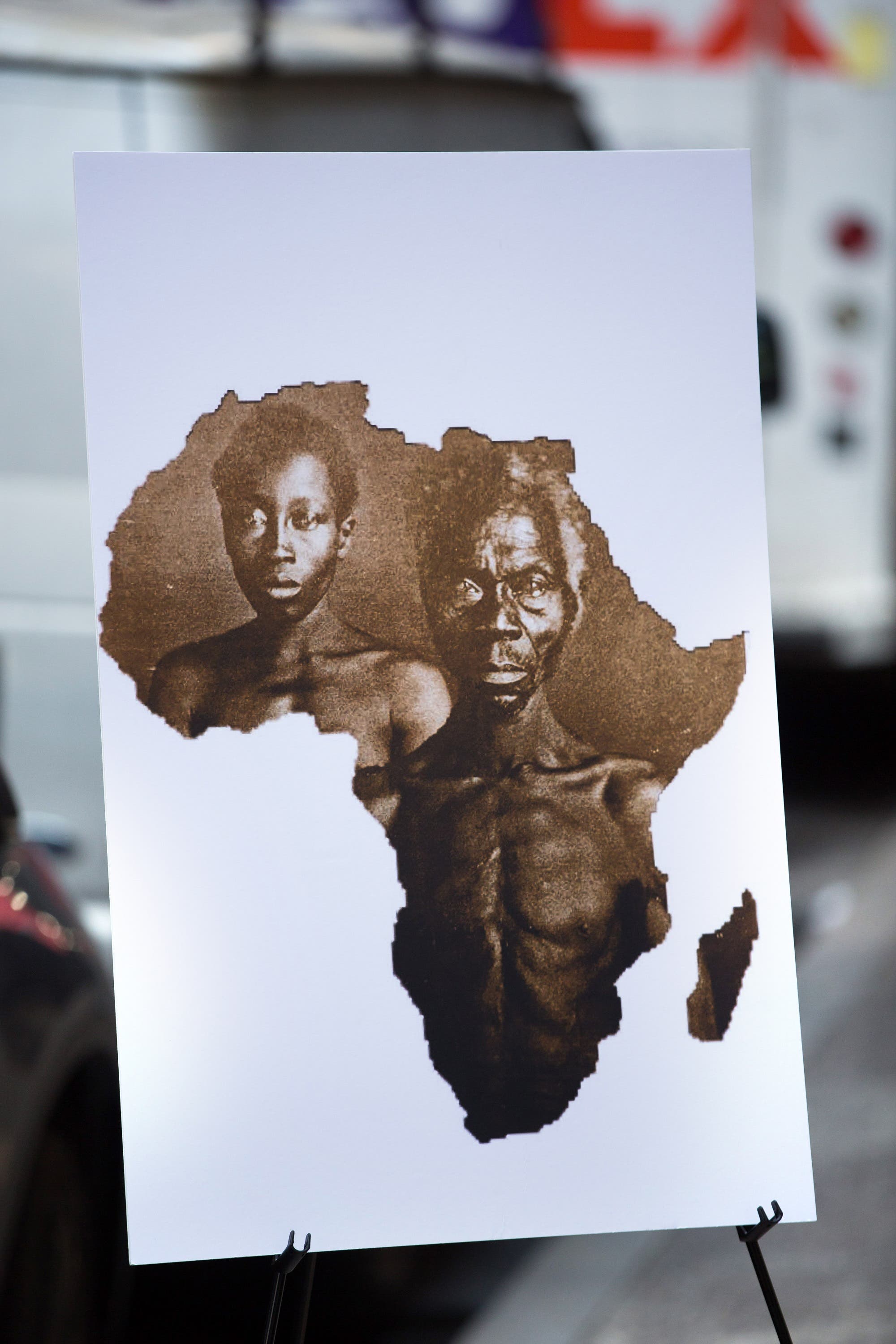 A sample image of “Papa” Rnety and his daughter Delia, taken in 1850, during a press conference announcing a lawsuit against Harvard University on March 20, 2019 in New York City. (AFP)